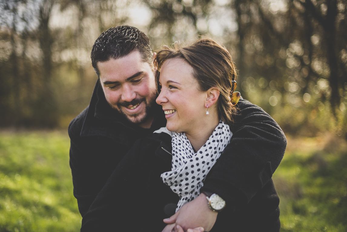 Couple session in the countryside - man and woman laugh - Couple Photographer