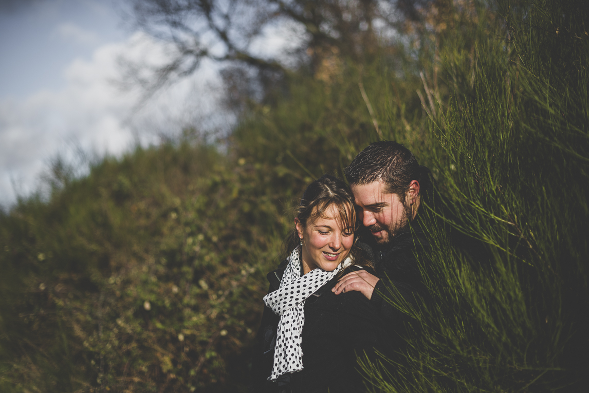 Couple session in the countryside - man and woman whisper - Couple Photographer