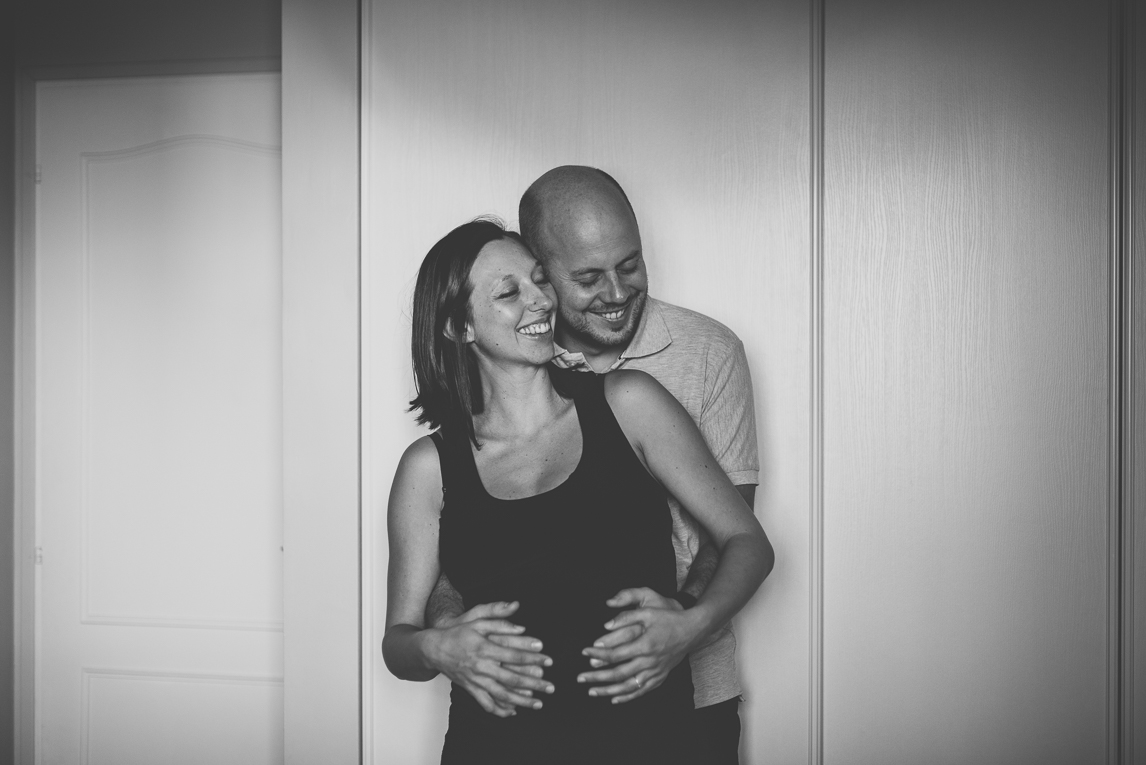 Pregnancy photo-shoot - man and pregnant woman hugging and smiling - Pregnancy Photographer