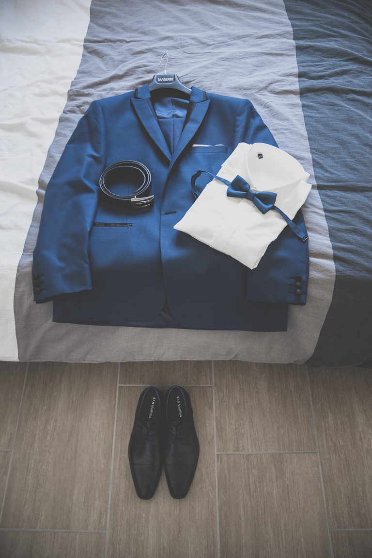 Winter Wedding Photography - groom's suit laid down on bed - Wedding Photographer