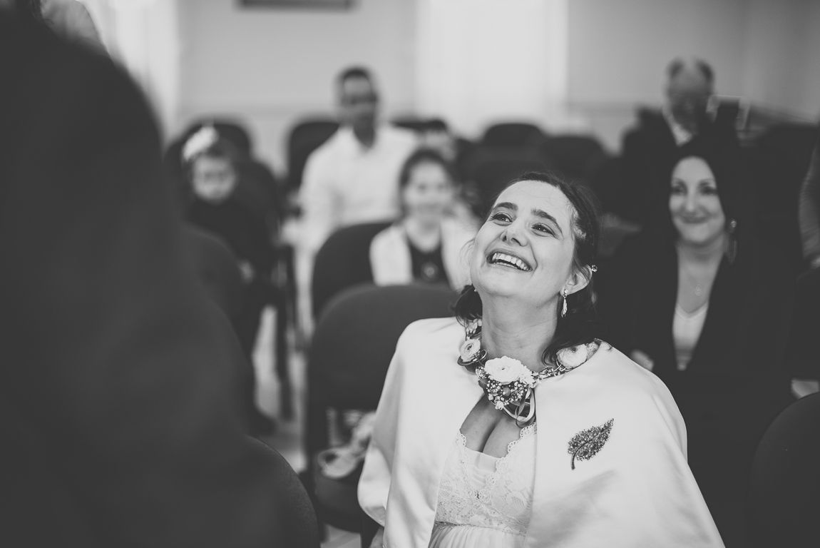 Winter Wedding Photography - bride laughs during exchange of vows - Wedding Photographer