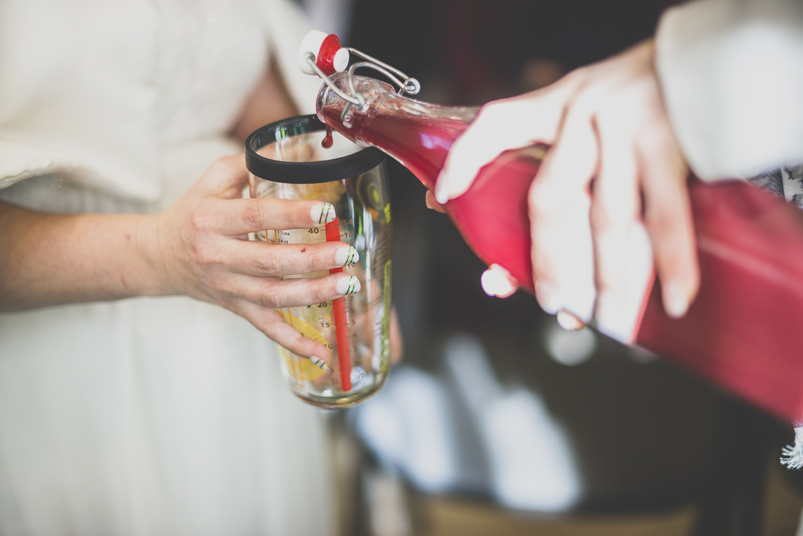 Winter Wedding Photography - witness pours juice during civil ceremony - Wedding Photographer