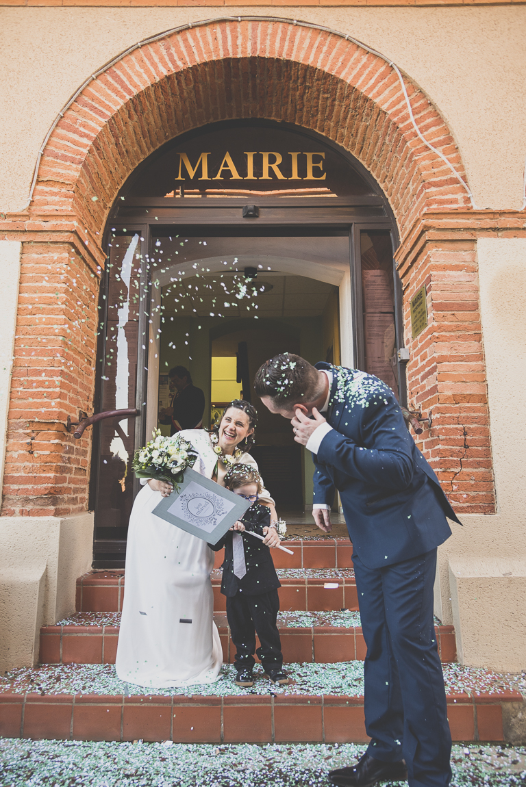 Winter Wedding Photography - bride and groom getting out of town hall - Wedding Photographer