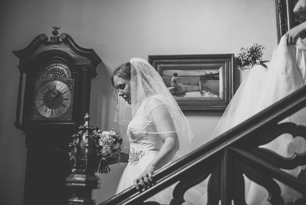 Wedding Photography French château - bride walking down the stairs - Wedding Photographer