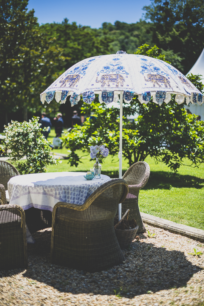 Wedding Photography French château - garden table and chairs and umbrella - Wedding Photographer