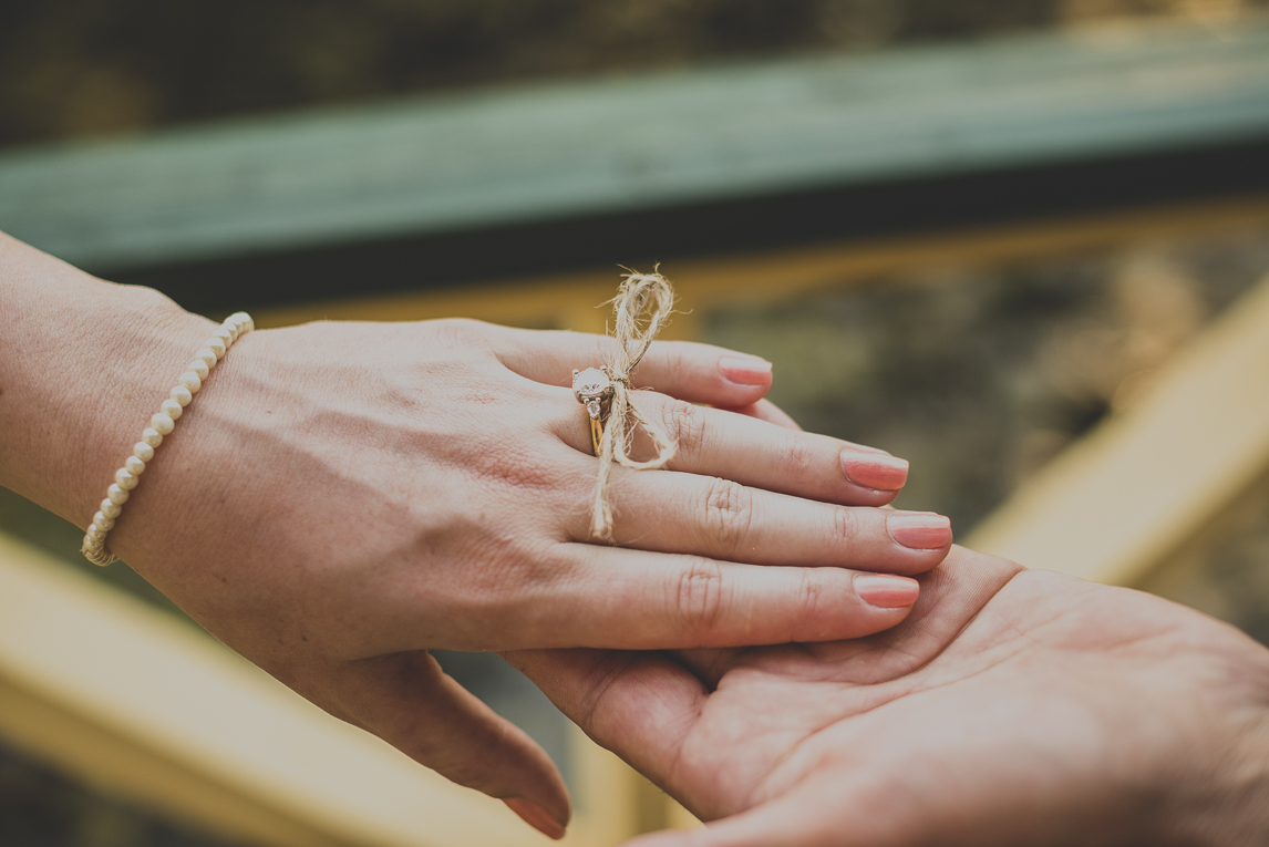 rozimages - wedding photography - close-up on brides hand being held by groom - Broome, Australia