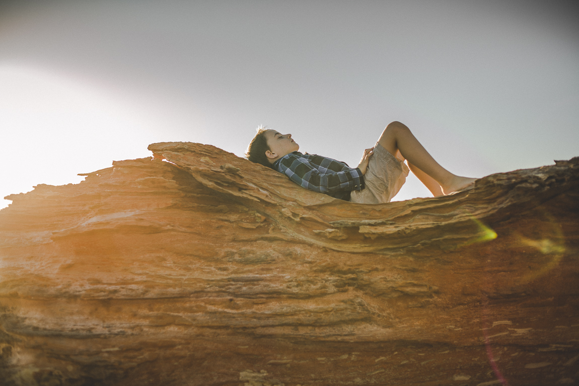 rozimages - family photography - beach session - boy lying on rock - Reddell Beach, Broome, Australia
