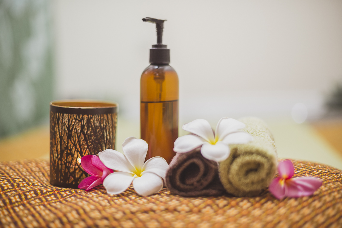 Thai Touch Massage Utopia Broome - rolled towels, oil bottle, candle and flowers - Commercial Photographer