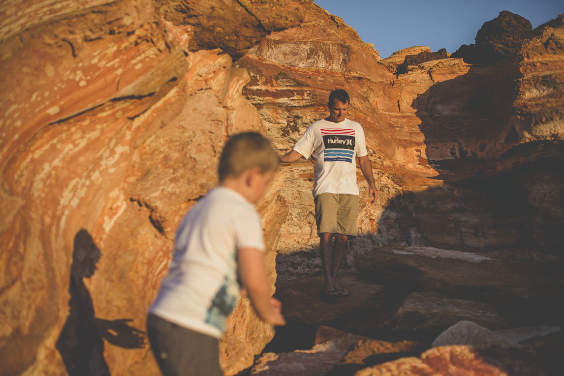 Family photo session - child and dad among red rocks - Family Photographer