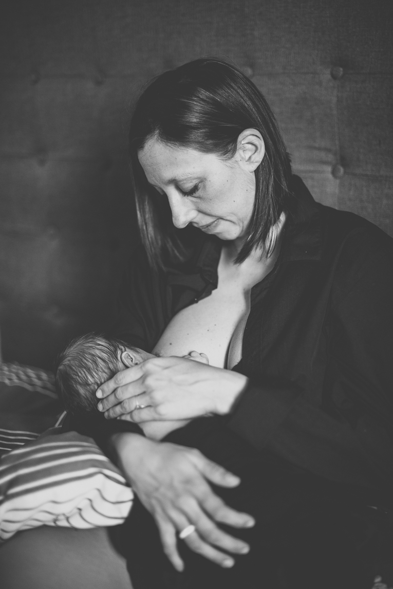 Newborn photo-shoot - mum breastfeeds baby - Newborn Photographer