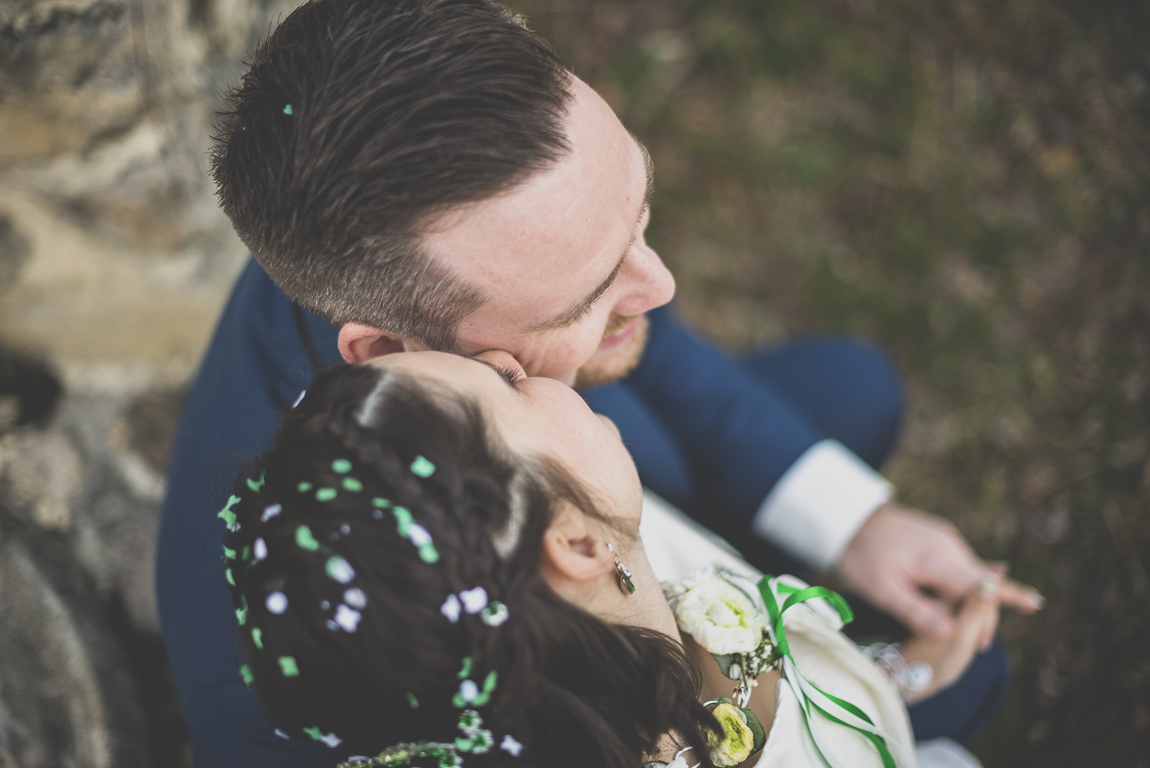 Winter Wedding Photography - bride kissing groom on cheek - Wedding Photographer