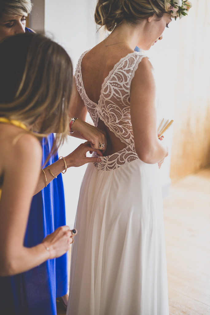 Wedding Photography Toulouse - bride putting on her dress - Wedding Photographer