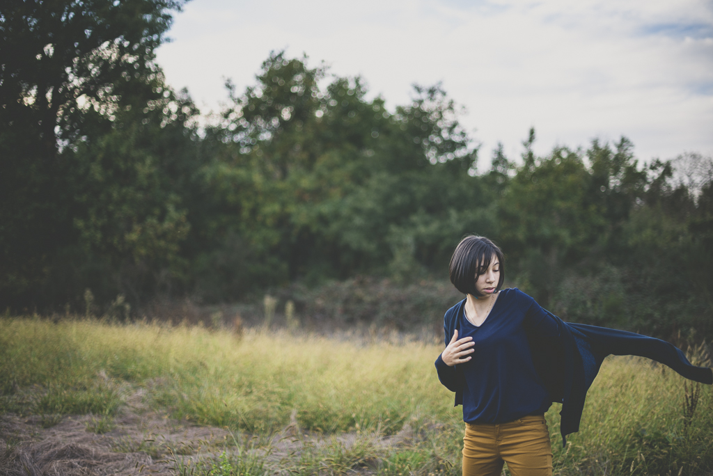 Outdoor family session - girl putting on cardigan - Family Photographer